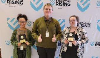  Students holding trophies